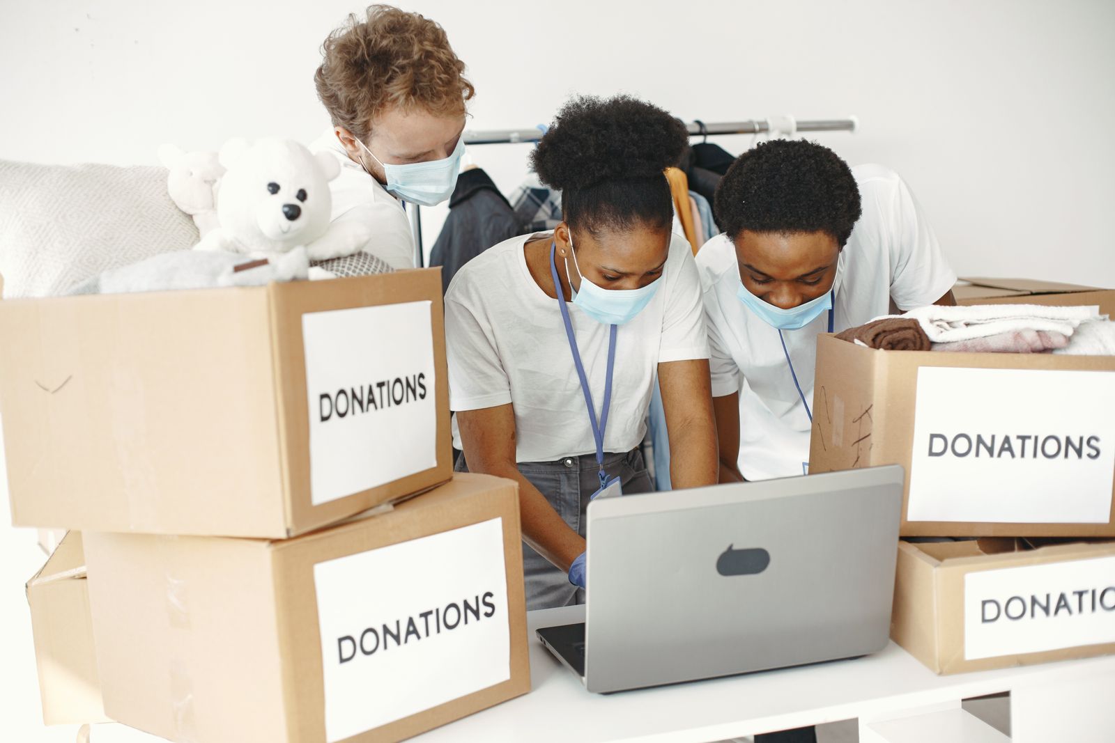 Community volunteers working with a laptop